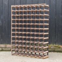 A large metal and wooden wine rack 83w x 23d x 103h cm