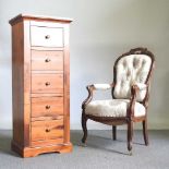 A modern hardwood narrow chest of drawers, 50cm wide, together with a Victorian style upholstered