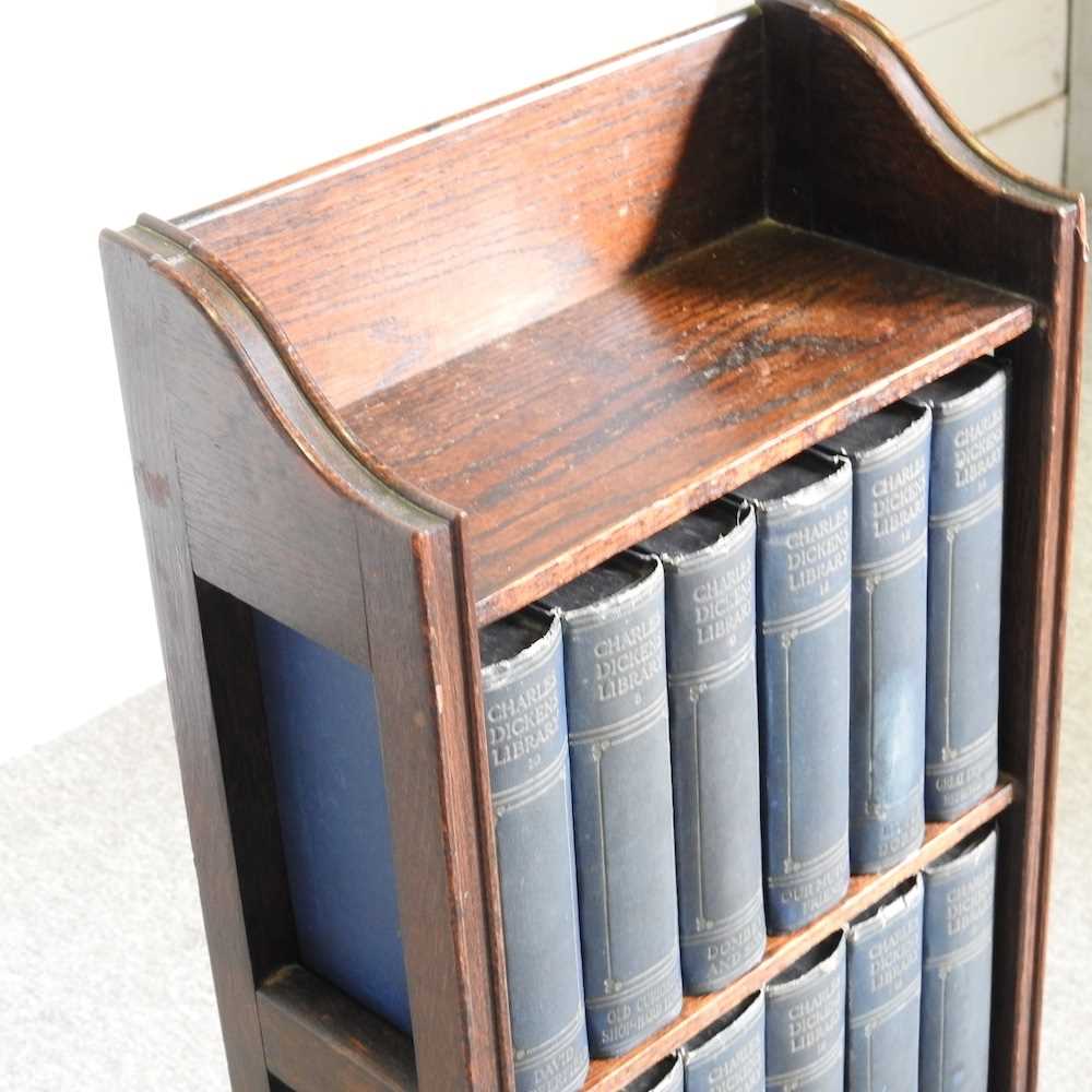 An early 20th century oak bookcase, containing a collection of Charles Dickens books 34w x 16d x 95h - Image 3 of 4