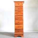 A modern hardwood narrow chest of drawers 40w x 43d x 135h cm