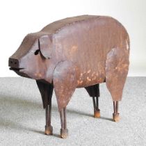 A rusted metal garden sculpture of a pig, 63cm long
