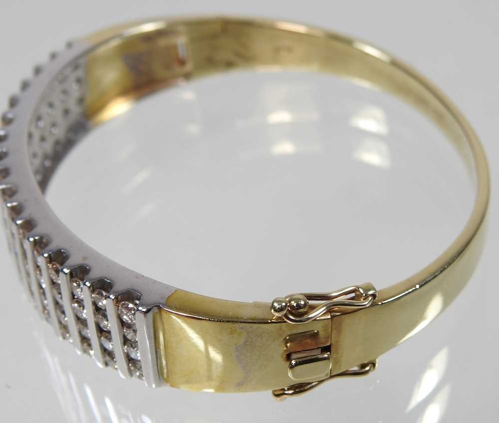 A 14 carat gold and diamond bangle, of hinged design, set with seventeen rows of four diamonds, - Image 3 of 6
