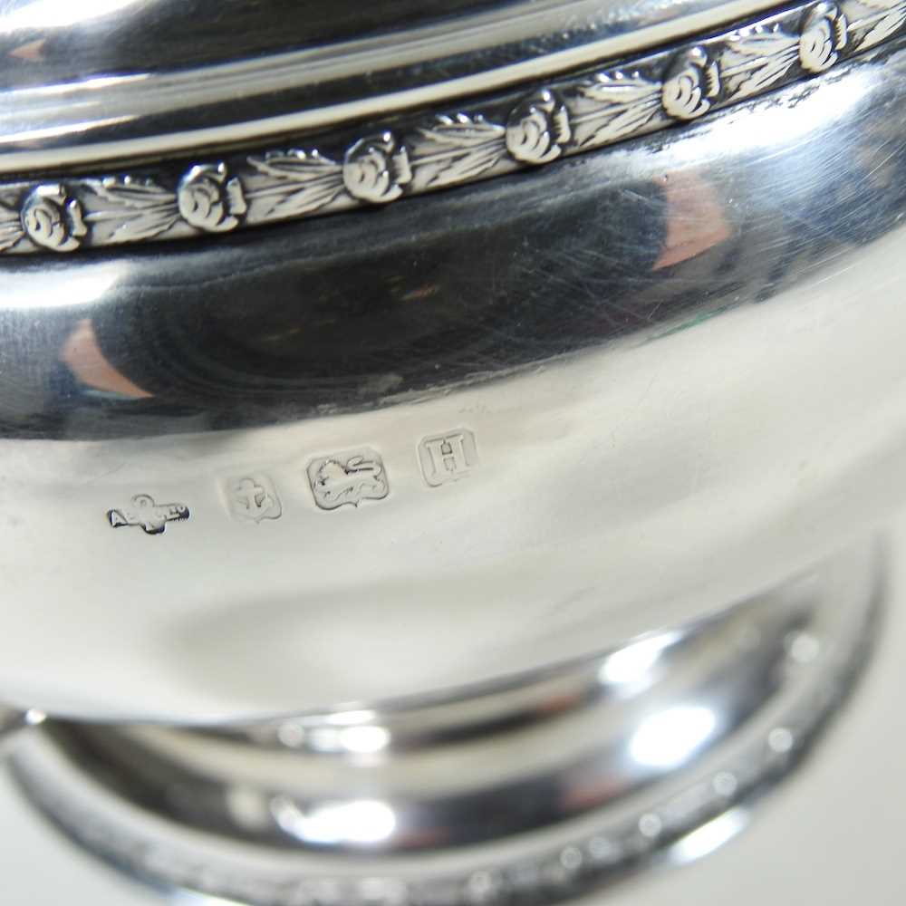 An early 20th century silver four piece tea service, of circular shape, with ebonised handles and - Image 4 of 8