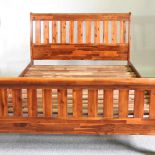 A modern Morris Furniture double bedstead, with a slatted wooden base 145cm wide