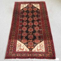 A Persian Belouch rug, with three rows of medallions, 210x 110cm