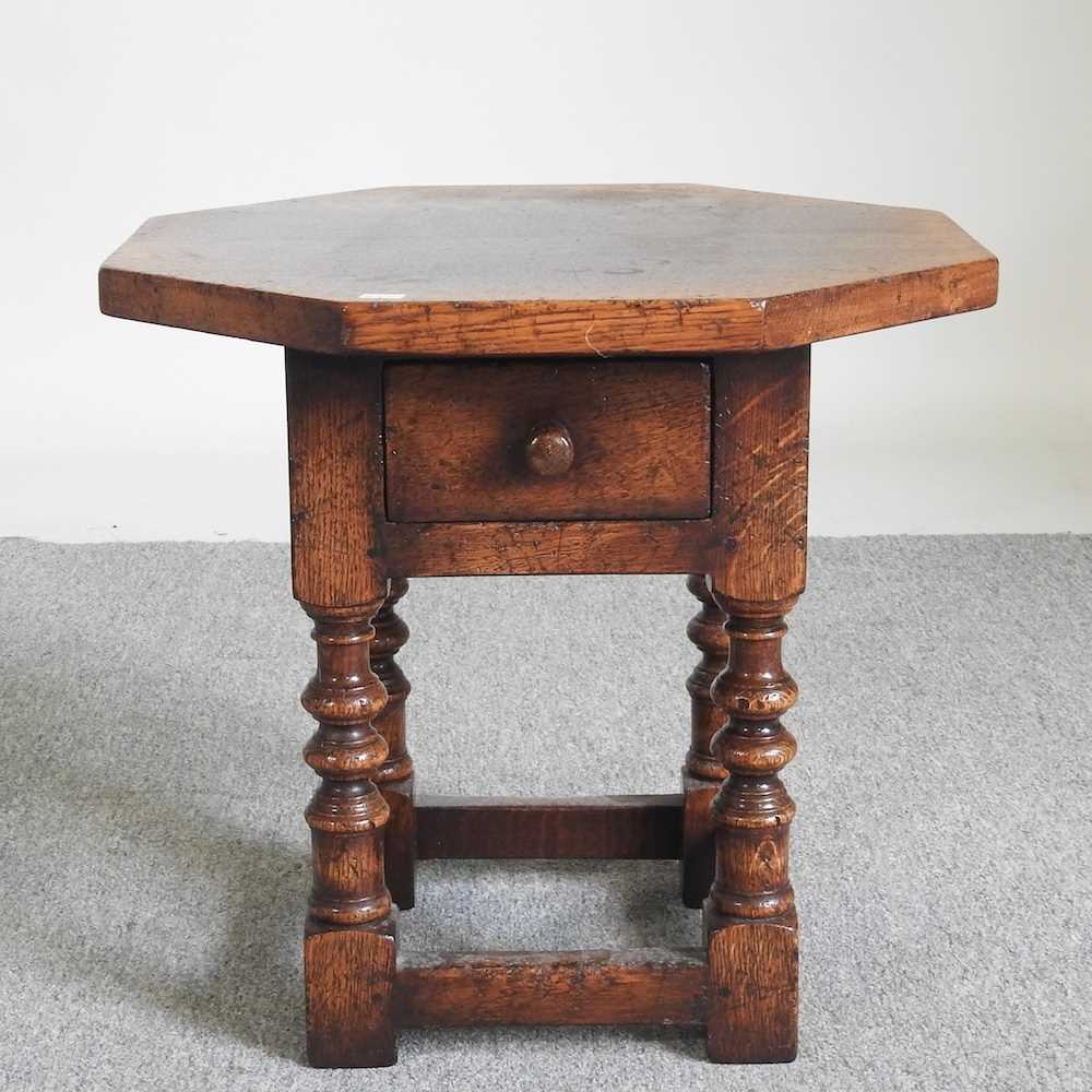 A small oak occasional table, of octagonal shape, 48cm wide