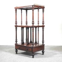 A 19th century rosewood canterbury whatnot, with a drawer below, on turned legs 56w x 41d x 104h cm
