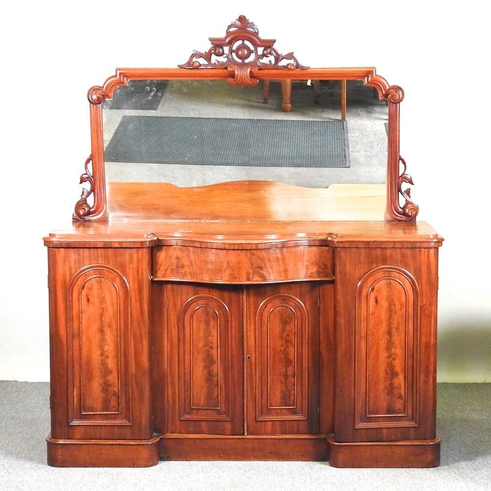 A Victorian mahogany mirror back chiffonier, of inverted breakfront shape, on a plinth base 149w x