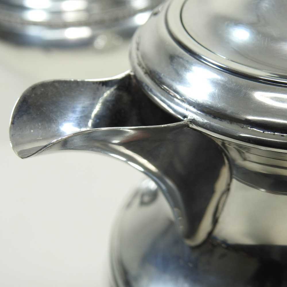 An early 20th century silver four piece tea service, of circular shape, with ebonised handles and - Image 7 of 8