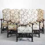 A set of six Carolean style carved walnut elbow chairs, with floral upholstery (6)