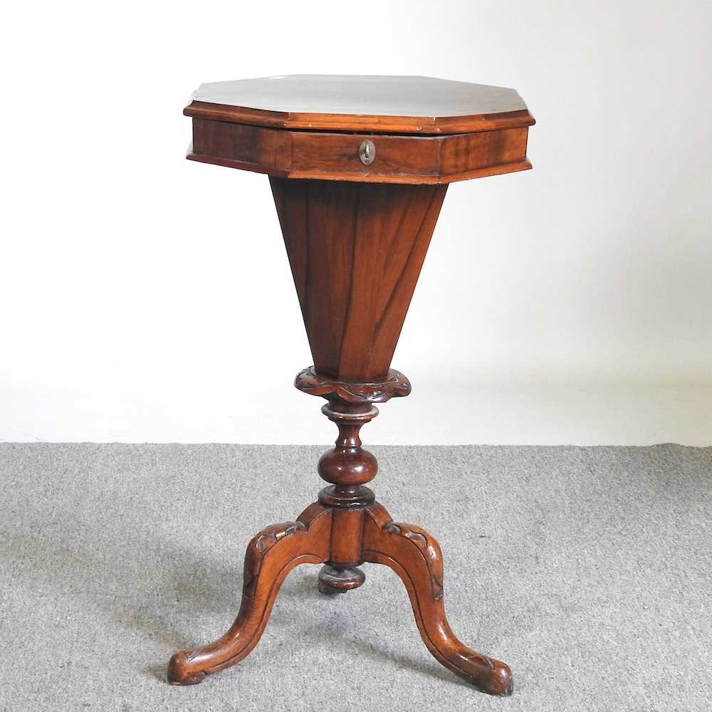 A Victorian burr walnut trumpet shaped workbox, with a fitted interior, on a tripod base, 42cm wide