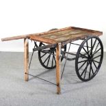 A wooden hand cart, with spoked wheels 146w x 80d x 72h cm