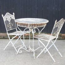 A cream painted metal circular garden table, together with a pair of folding chairs (3) 76w x 78h