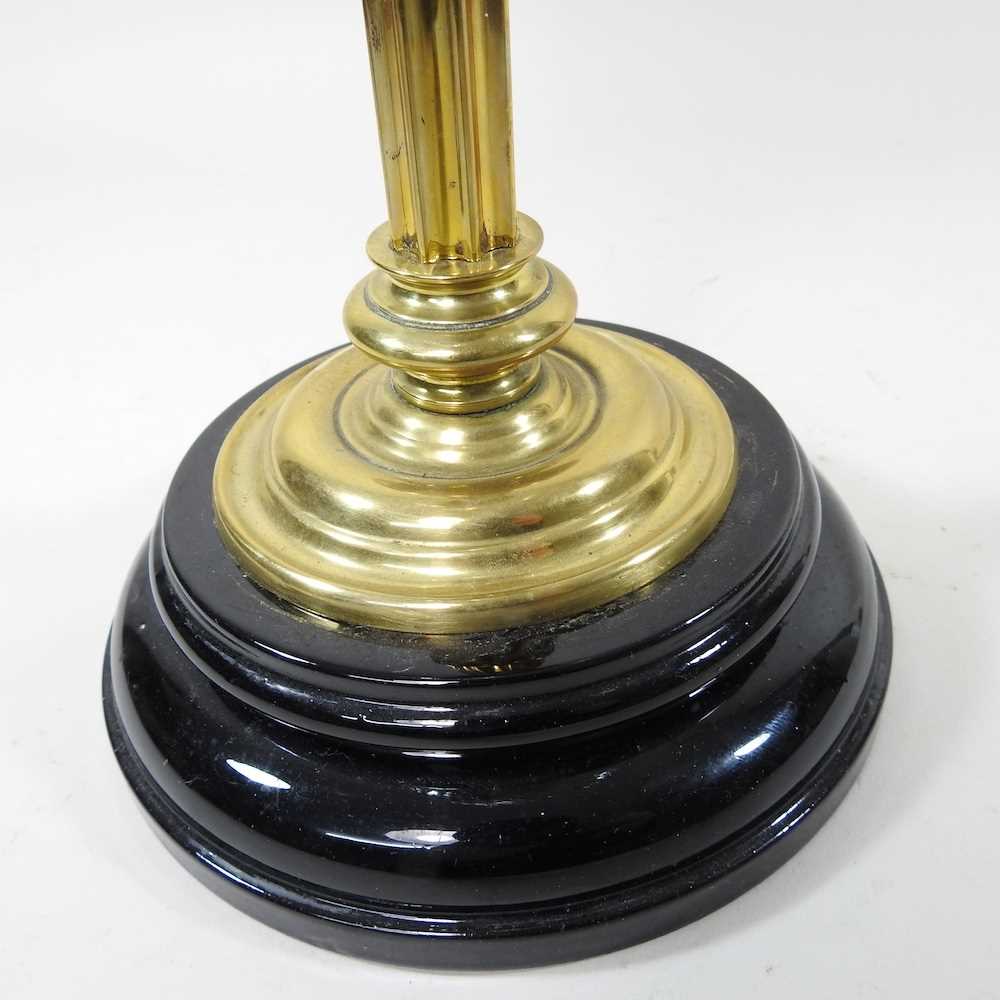 A 19th century brass oil lamp, with a cranberry glass chimney, 65cm high Cranberry chimney is - Image 2 of 6