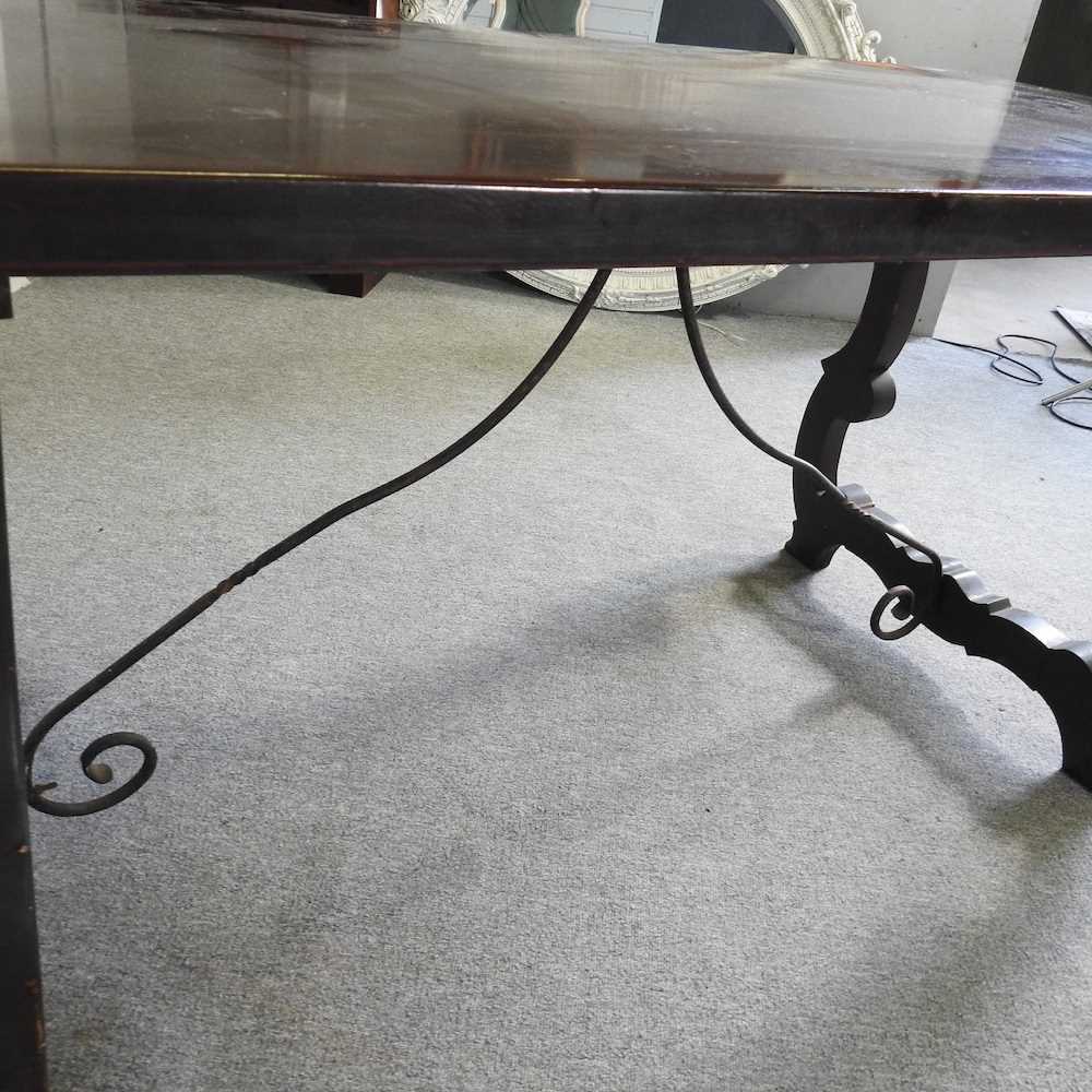 A Spanish dining table, 20th century, on a splayed base with iron supports 151w x 76d x 76h cm - Image 2 of 5