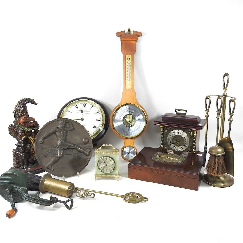 A cast iron Mr Punch doorstop, together with a collection of clocks, cutlery and metalwares, to
