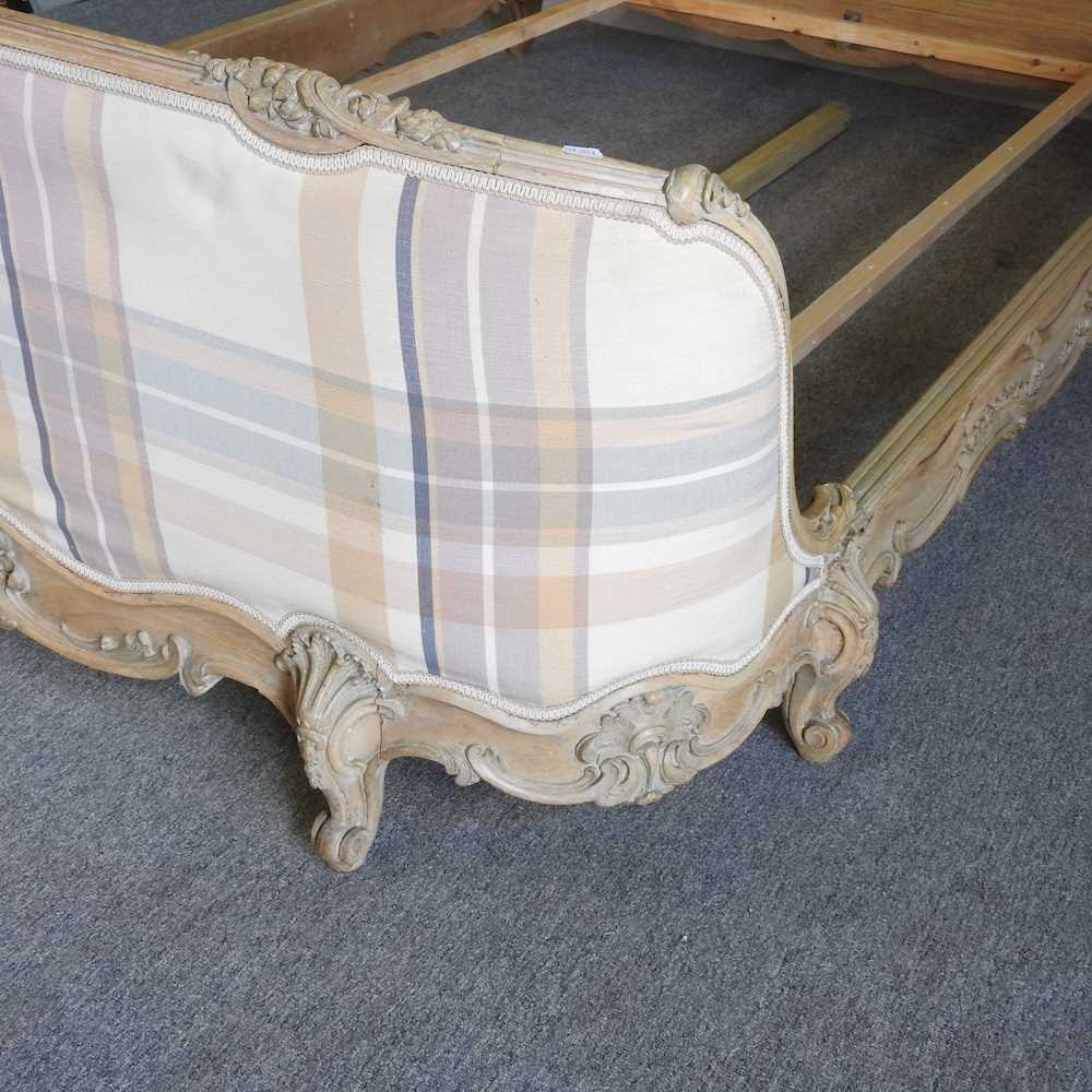 A later 20th century French limed and cream check upholstered double bedstead, with a slatted wooden - Image 3 of 5