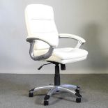 A modern white upholstered swivel office chair