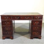 A reproduction pedestal desk, with an inset top 122w x 60d x 77h cm