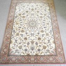 A Kashan rug, with foliate designs, on a cream ground, 301 x 200 cm