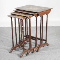 An early 20th century quartetto of occasional tables, polychrome painted with flowers, on ring