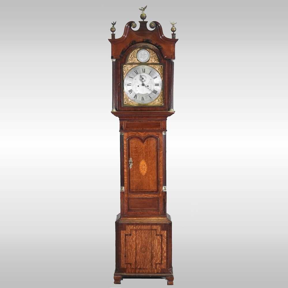 A George III oak and mahogany crossbanded cased longcase clock, with a swan neck pediment, the