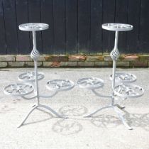 A pair of painted metal tiered plant stands (2) 55w x 78h cm