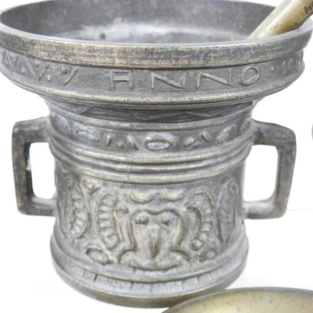 A bronze pestle and mortar, inscribed niette verwin anno 1480, 13cm high, together with another - Image 2 of 4