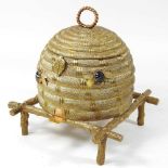 A 19th century gilt brass jewellery box, in the form of a bee skep, with a velvet lined interior,