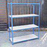 A blue painted metal shelving unit, with four chipboard shelves 123w x 46d x 160h cm