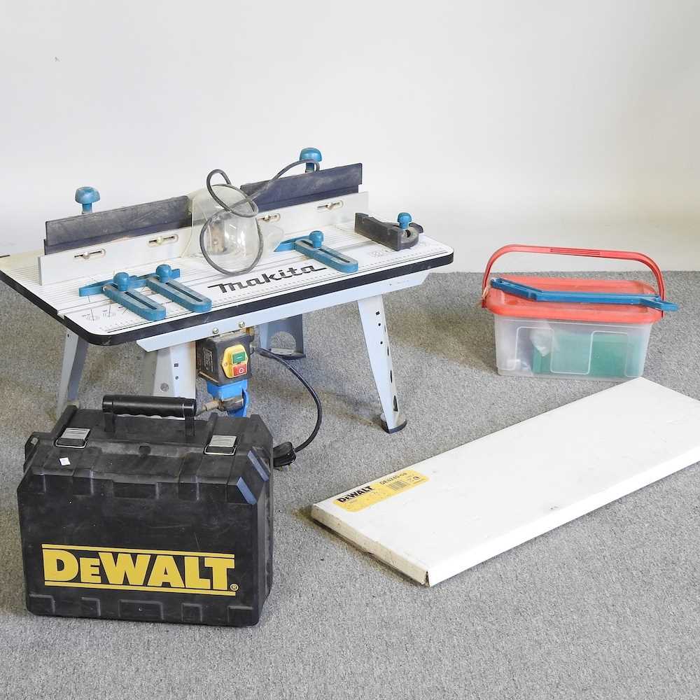 A De Walt router, with a Makita routing table