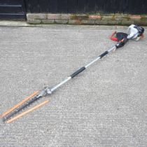 A petrol pole hedge cutter