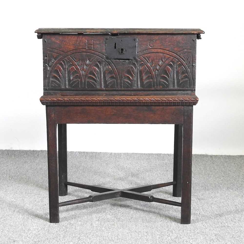 A 19th century carved oak Bible box, inscribed H G, on a later stand 55w x 44d x 66h cm