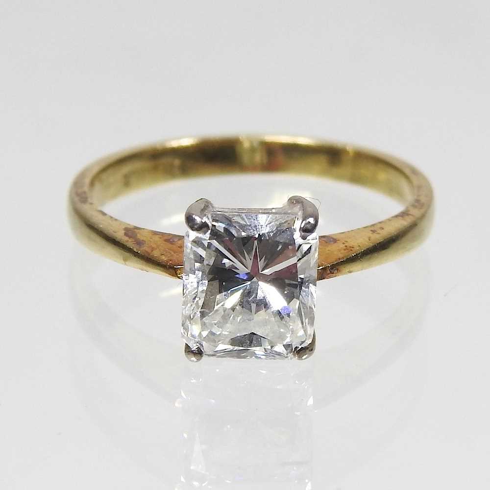 An 18 carat gold princess cut solitaire diamond ring, approximately 1.75 carats, 2.7g, size K,