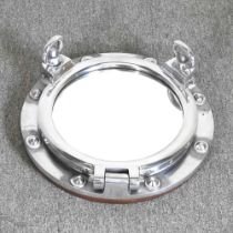 A novelty mirror, in the form of a ship's porthole window, 43cm diameter