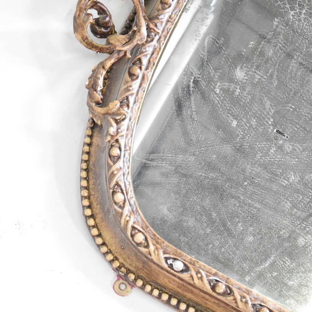 A 19th century gilt framed over mantel mirror, of arched shape, within a moulded surround, - Bild 4 aus 5
