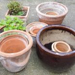 A collection of garden pots, widest 49cm