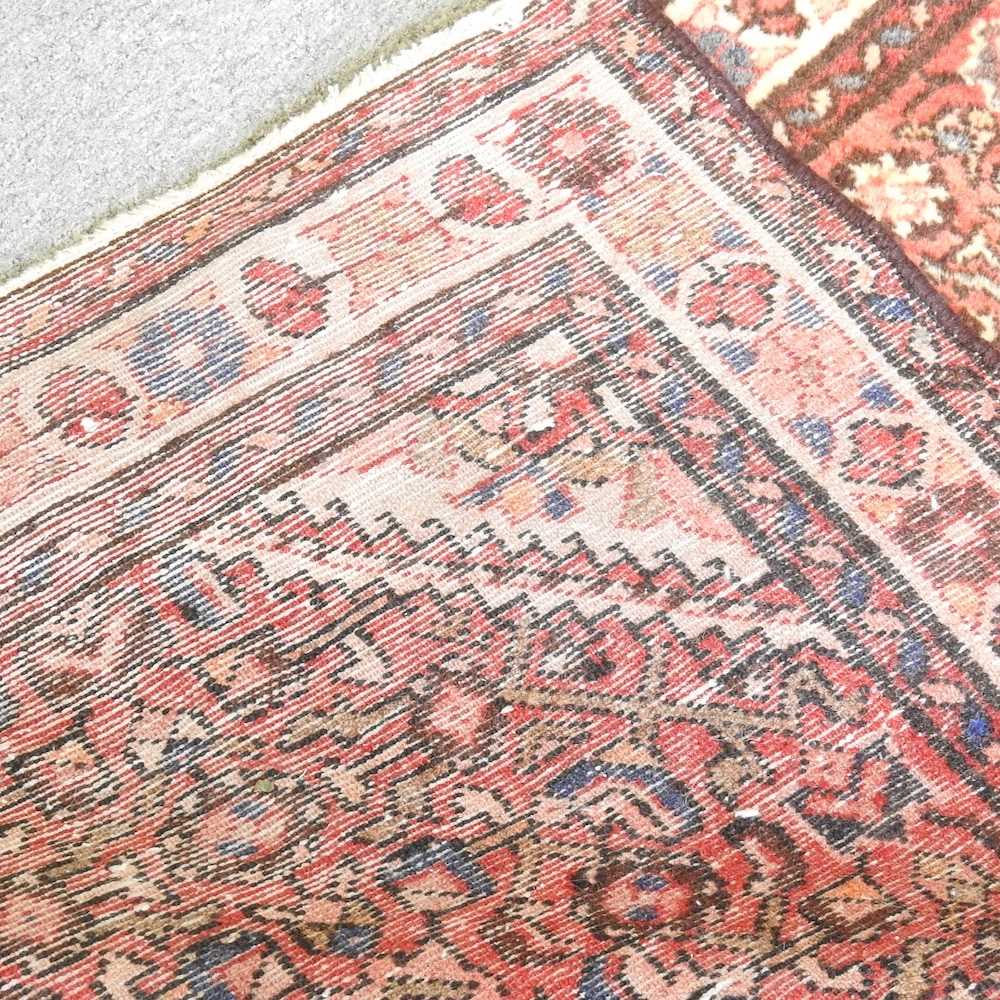A Persian malayer runner, with flowerhead motifs, on a red ground, 308 x 85cm - Image 2 of 5