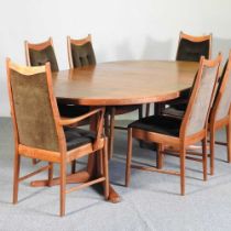 A 1960's McIntosh teak extending dining table, with two additional leaves, together with a set of