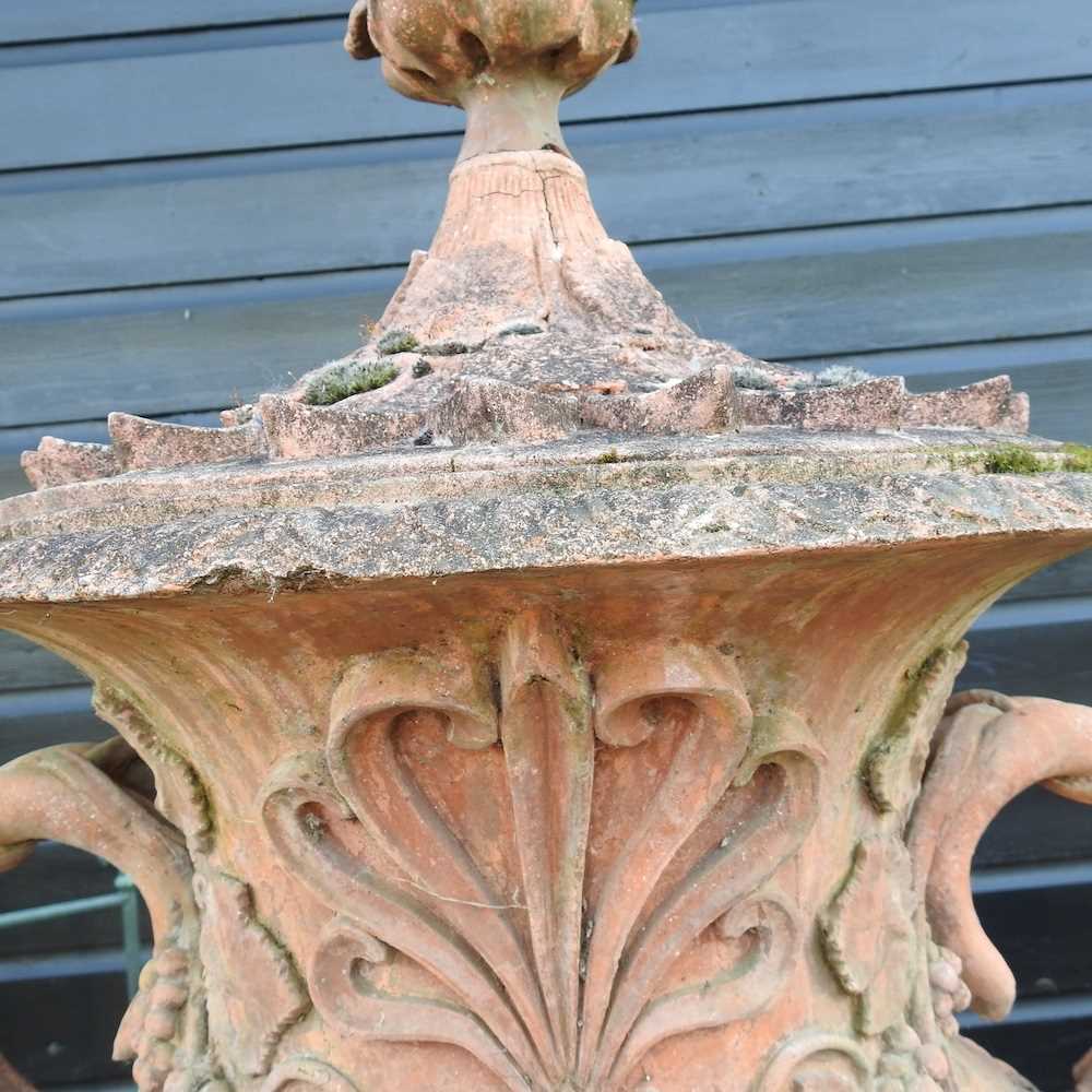 A very large terracotta stone garden urn and cover, of twin handled form, relief decorated with - Image 2 of 7