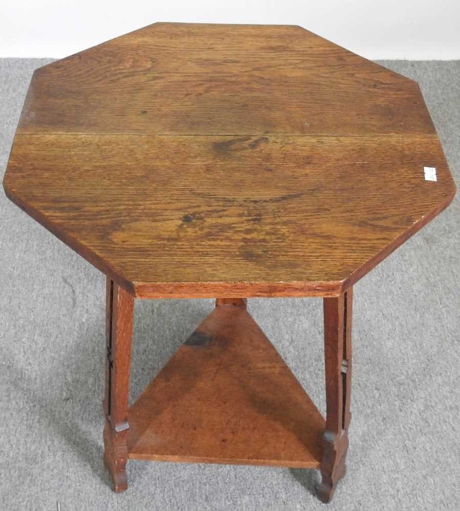 An Art Nouveau oak occasional table, with an octagonal top, on a splayed base 51w x 51d x 75h cm - Image 4 of 4