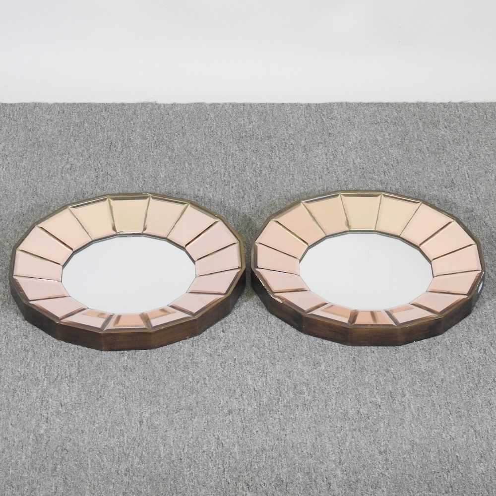 A pair of Art Deco style wall mirrors, of circular shape, 41cm diameter (2)