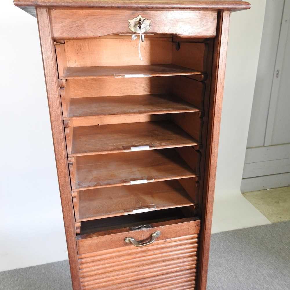 An early 20th century oak tambour front filling cabinet, on a plinth base 46w x 39d x 151h cm - Bild 5 aus 7