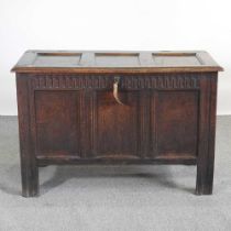 An 18th century panelled oak coffer, with a hinged lid and thumbnail decoration 113w x 53d x 76h cm
