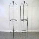 A pair of painted metal garden obelisks, 190cm high