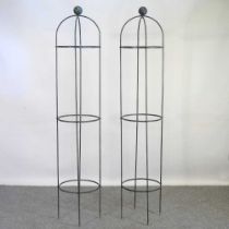 A pair of painted metal garden obelisks, 190cm high