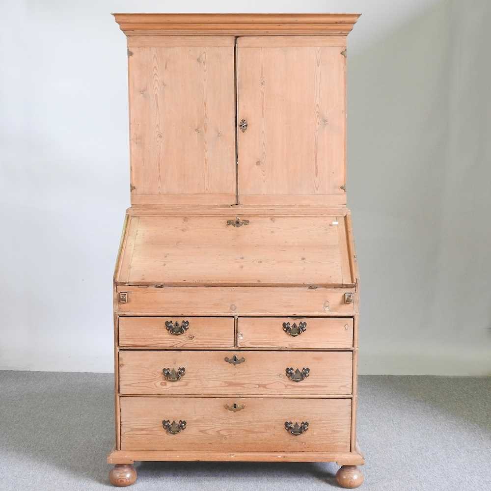 A 19th century stripped pine bureau cabinet, with a fitted interior 96w x 55d x 179h cm