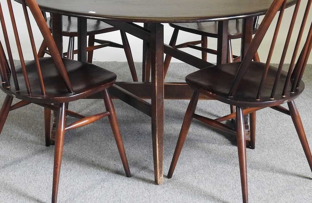 An Ercol dark elm drop leaf dining table, together with a set of four hoop back dining chairs (5) - Image 3 of 5