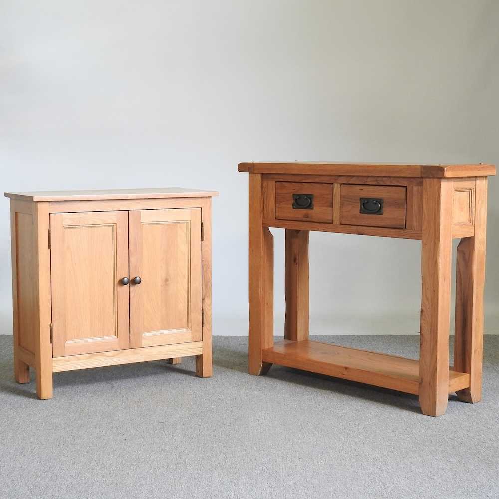 A modern light oak side cabinet, together with an oak side table, with two drawers, 91cm wide (2)
