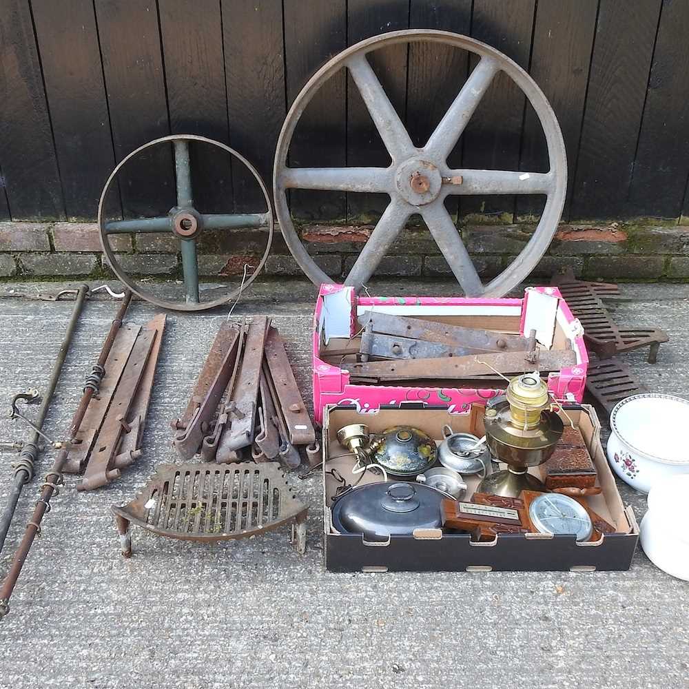 A vintage cast iron cart wheel, 87cm, together with another smaller and a collection of